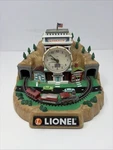 100TH Anniversary Lionelville Railroad Station Alarm Clock W/ Train Testd Used. Price: $39.99.